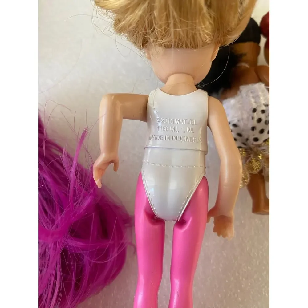 group of small Barbie Club Chelsea dolls and miniature figures in mixed outfits